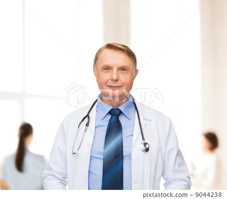 smiling doctor or professor with stethoscope 9044238