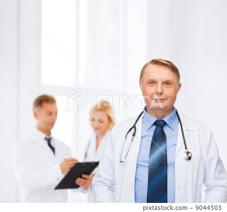 smiling doctor or professor with stethoscope 9044503
