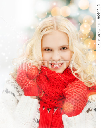 smiling teenage girl in red mittens and scarf smiling teenage girl in red mittens and scarf 9044943