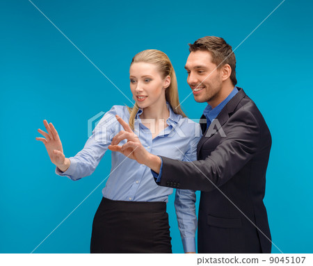 woman and man working with virtual screen woman and man working with virtual screen 9045107