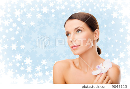 relaxed woman with orhid flower relaxed woman with orhid flower 9045113