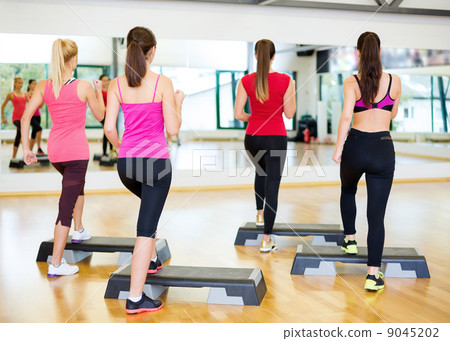 group of smiling people doing aerobics group of smiling people doing aerobics 9045202