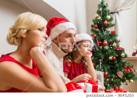 depressed family at home with many gift boxes depressed family at home with many gift boxes 9045203