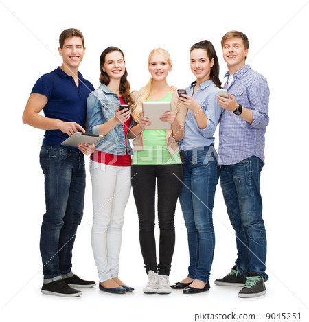 smiling students using smartphones and tablet pc 9045251