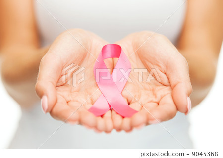 hands holding pink breast cancer awareness ribbon hands holding pink breast cancer awareness ribbon 9045368