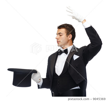 magician in top hat showing trick 9045369