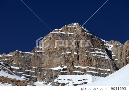 Rocks in snow and blue clear sky Rocks in snow and blue clear sky 9051693