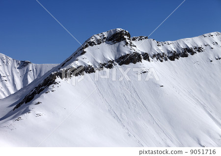 Off piste slope with traces of avalanches 9051716