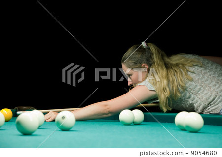 Woman aiming for billiard table Woman aiming for billiard table 9054680