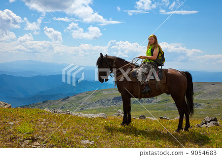 tourist on horseback at mountains tourist on horseback at mountains 9054683