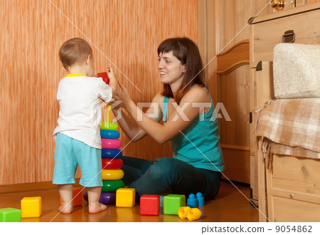 mother and baby plays with pyramidion mother and baby plays with pyramidion 9054862