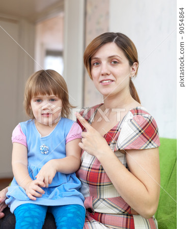 Mother scolds child in home Mother scolds child in home 9054864