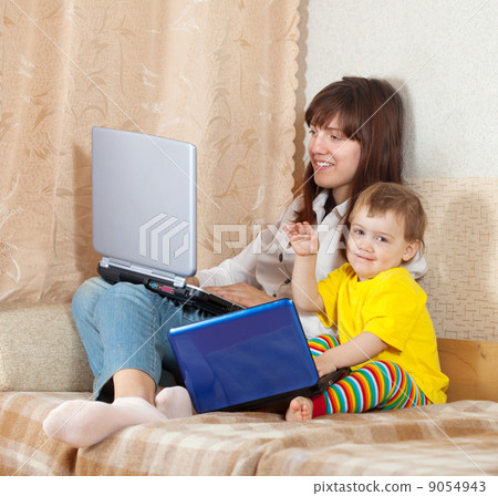woman and child with laptops woman and child with laptops 9054943