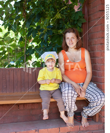 mother and child in veranda mother and child in veranda 9055125