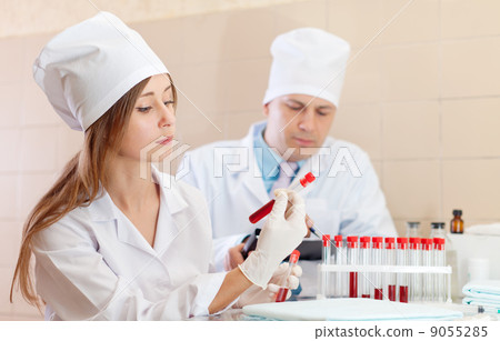 nurse and  doctor with test tubes 9055285