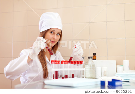 nurse with test tube in laboratory 9055291