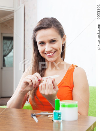Beautiful girl cares for nails Beautiful girl cares for nails 9055501