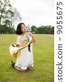 Horn player image (playing, blowing, lawn) 9055675