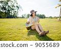 Horn player image (playing, blowing, lawn) 9055689