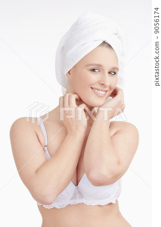 Beautiful Young Woman with Towel on her Head Smiling 9056174