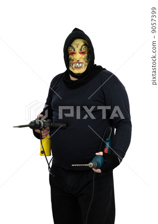 Maniac holds in hands one perforator and electric drill Maniac holds in hands one perforator and electric drill 9057399