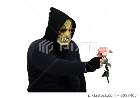 Glasses monster examines pink rose 9057403