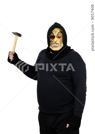Maniac in a mask brandishes a claw hammer Maniac in a mask brandishes a claw hammer 9057406