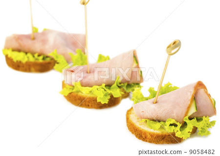 canape with meat vegetables and seafood 9058482
