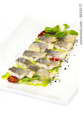 baked black cod fish on a white background in the restaurant 9058577