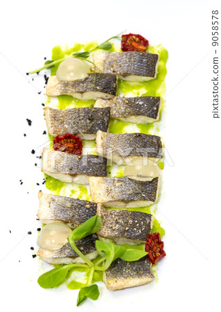 baked black cod fish on a white background in the restaurant 9058578