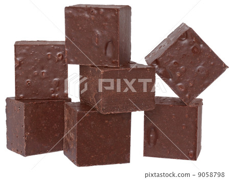 Cubes of chocolate close up isolated. Cubes of chocolate close up isolated. 9058798