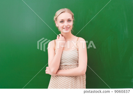teacher near blackboard teacher near blackboard 9060837