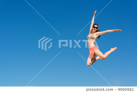 young woman jumping young woman jumping 9060982