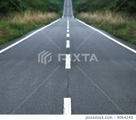 Straight tar road leading into the light Straight tar road leading into the light 9064248