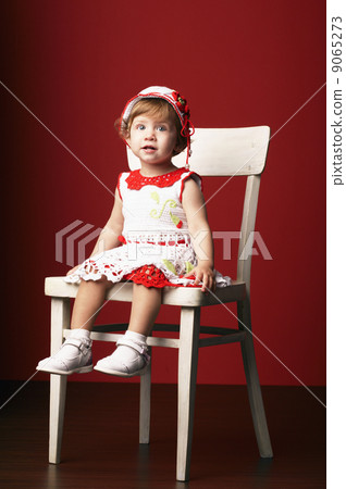 little girl sitting on chair little girl sitting on chair 9065273
