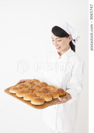 Woman in chef's coat Woman in chef's coat 9065747