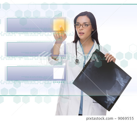 Female Doctor or Nurse Pushing Blank Button on Panel Female Doctor or Nurse Pushing Blank Button on Panel 9069555