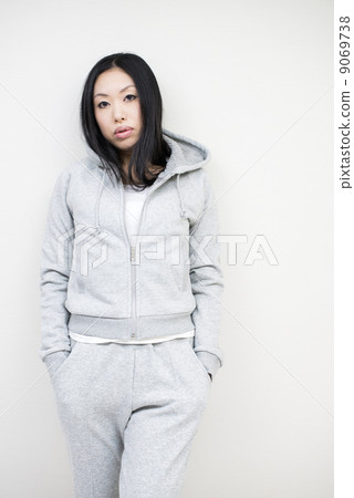 A woman standing in sweat parka A woman standing in sweat parka 9069738