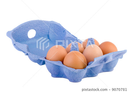 Cardboard egg box with six brown eggs 9070781
