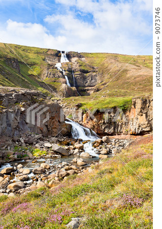 Summer Iceland Landscape with Waterfall and Bright Blue Sky 9073746