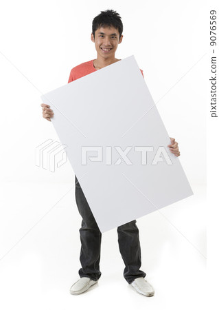 Chinese man holding up a banner. Chinese man holding up a banner. 9076569