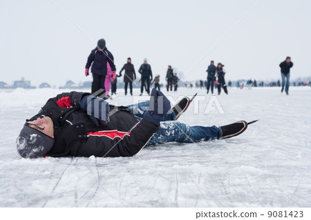 Man fallen on the ice during ice skating (Eemdijk, the Netherlan Man fallen on the ice during ice skating (Eemdijk, the Netherlan 9081423