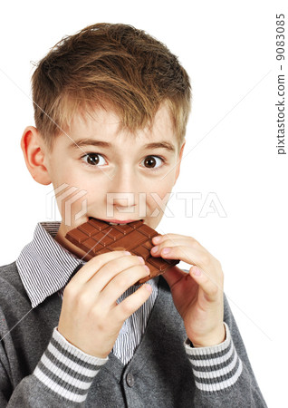 Boy Eating A chocolate bar Boy Eating A chocolate bar 9083085