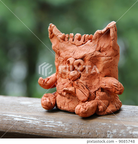 Child's ceramic handicraft. Funny cat statuette. 9085748