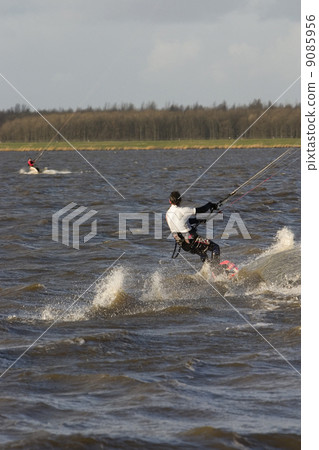 Kite surfing at Gooimeer near Huizen (the Netherlands) Kite surfing at Gooimeer near Huizen (the Netherlands) 9085956