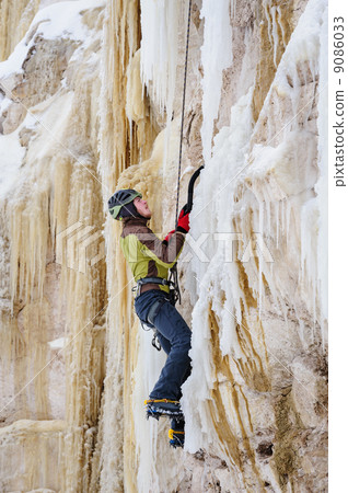 Young man climbing the ice Young man climbing the ice 9086033