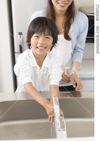 My son and mother washing my hands in the kitchen 9088052