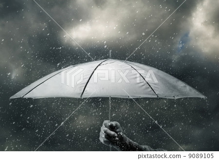Umbrella in hand under raindrops 9089105