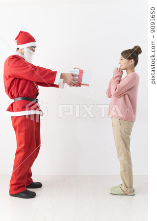Santa Claus and a young lady Santa Claus and a young lady 9091650