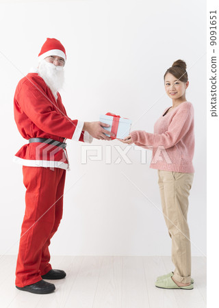 Santa Claus and a young lady Santa Claus and a young lady 9091651
